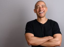 Smiling patient after successful tooth replacement at Smile Dental Group
